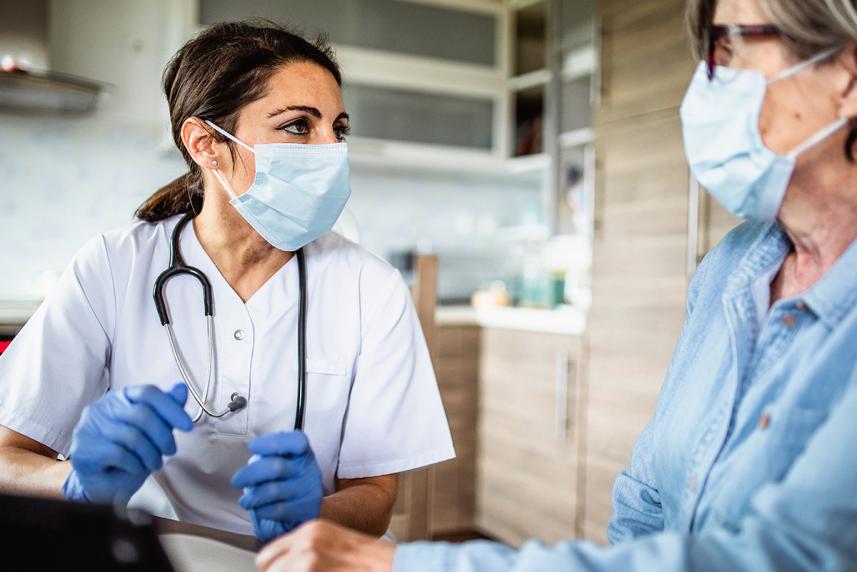 A woman speaking to a medical care professional